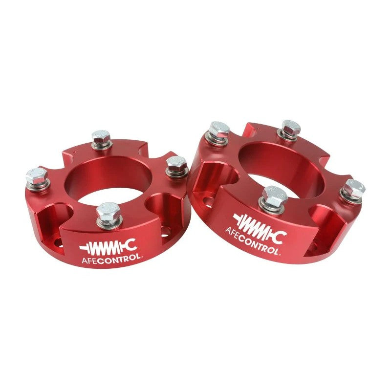 Red anodized CNC-machined 6061 billet aluminum strut spacers for aFe CONTROL 1.875-inch Tundra leveling kit