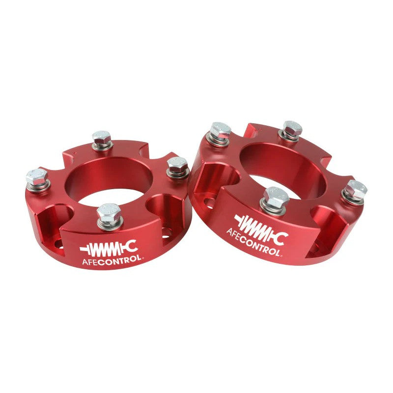 Red anodized CNC machined 6061 billet aluminum 2.5-inch front leveling spacers for 2007-2021 Toyota Tundra.