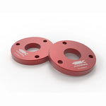 Two red anodized CNC machined 6061 billet aluminum 1.25-inch leveling spacers with high-strength mounting hardware.