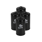 Four aFe Pro GUARD D2 white oil filters featuring integrated 3/8 inch ratchet drive for Ford 6.7L diesel trucks