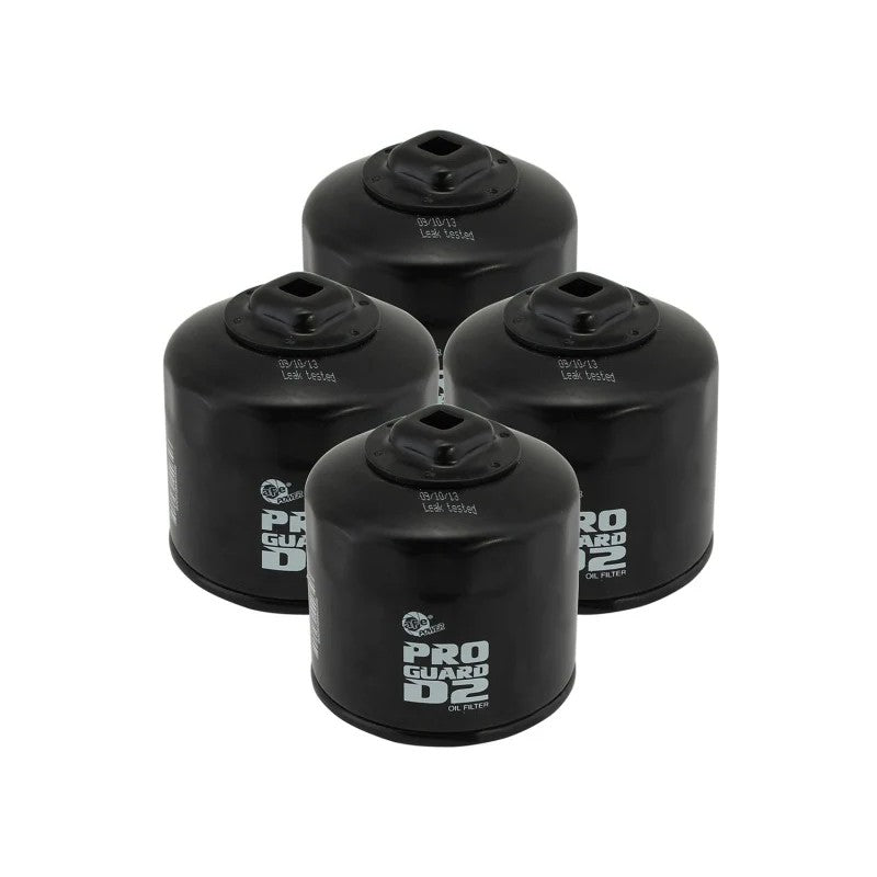 Set of four aFe Pro GUARD D2 high-flow oil filters with heavy-duty black canisters.