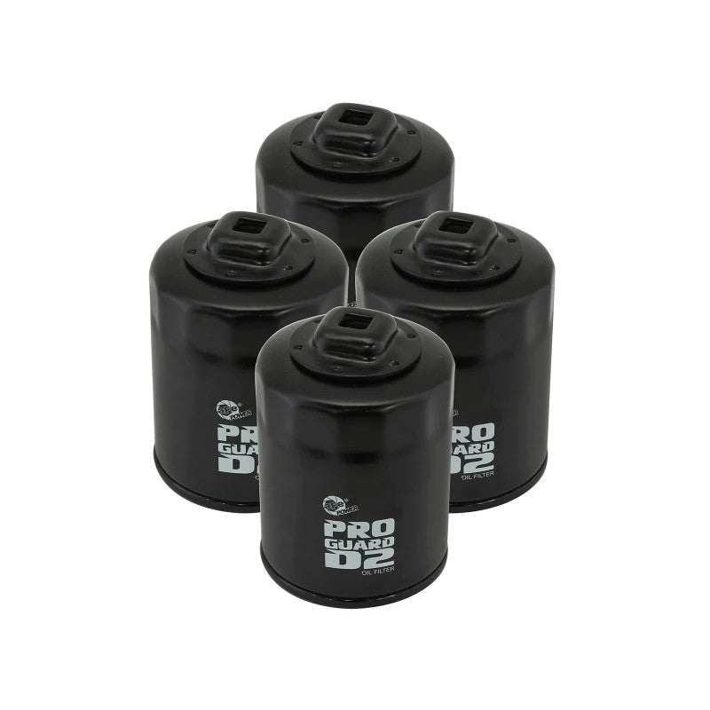 Four aFe Pro GUARD D2 canister oil filters with integrated 3/8 inch ratchet drives and included sealing O-rings.