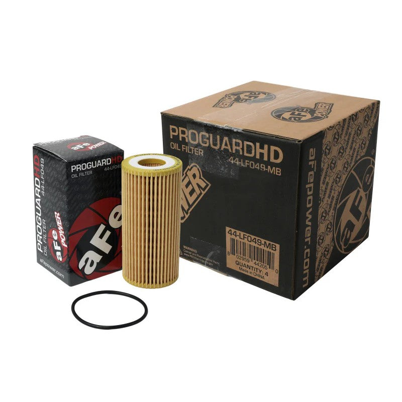 Set of four aFe Power Pro GUARD HD black canister oil filters featuring high-performance synthetic media.