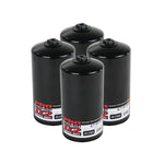Set of four aFe Power ProGuard D2 high-performance oil filters for Ford 7.3L diesel engines.