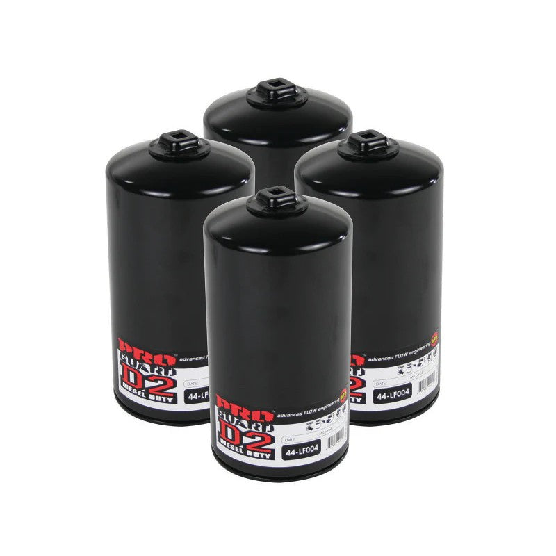 Set of four aFe Power ProGuard D2 high-performance oil filters for Ford 7.3L diesel engines.