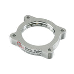 Black anodized 6061-T6 billet aluminum aFe Silver Bullet throttle body spacer with patented serrated helix design.
