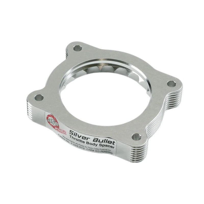 Black anodized 6061-T6 billet aluminum aFe Silver Bullet throttle body spacer with patented serrated helix design.
