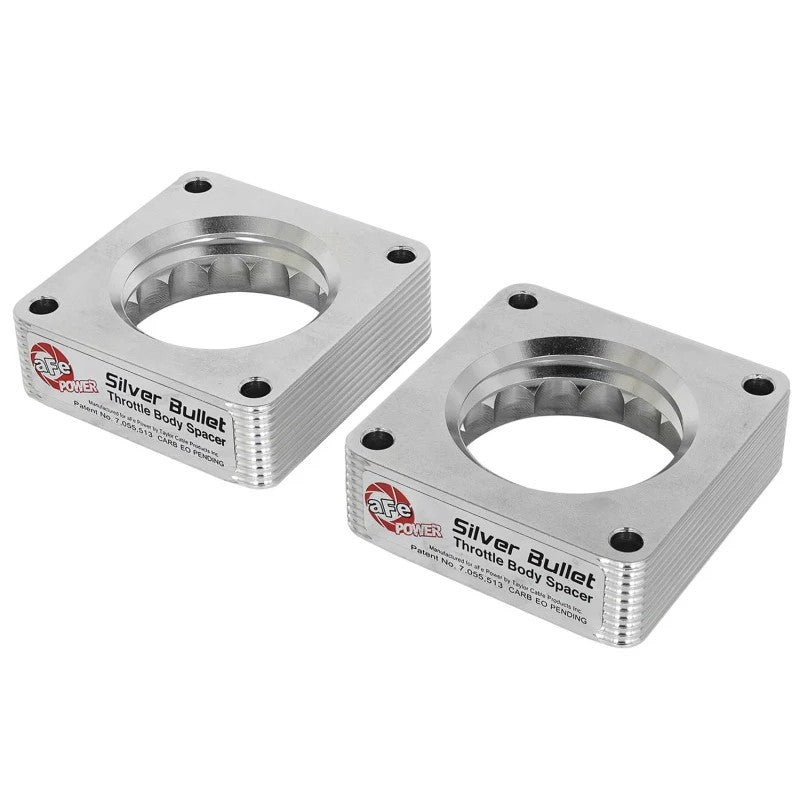 Pair of aFe Silver Bullet 6061-T6 billet aluminum throttle body spacers for Nissan and Infiniti V6-3.7L engines.