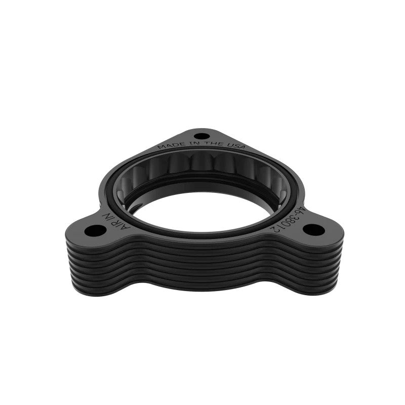 Black anodized aFe Power Silver Bullet throttle body spacer CNC-machined from 6061-T6 billet aluminum.