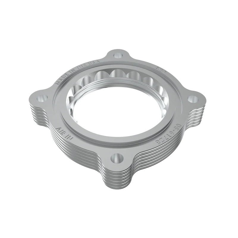 CNC-machined 6061-T6 billet aluminum throttle body spacer with serrated helix design and mounting hardware.