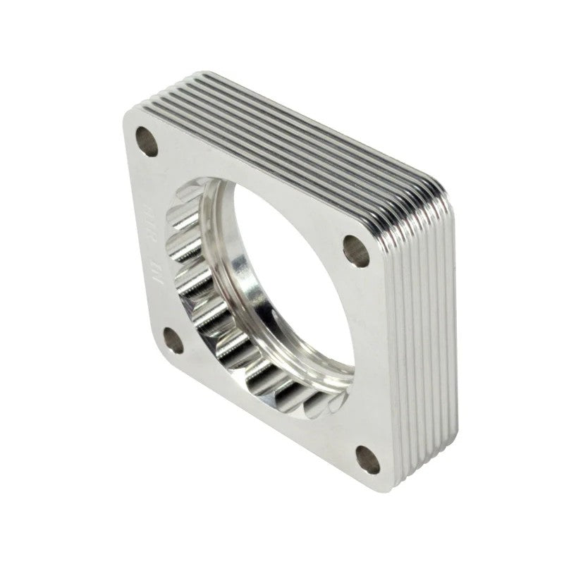 aFe Silver Bullet throttle body spacer machined from T-6061 billet aluminum with a serrated helix entry design.