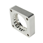 aFe Silver Bullet throttle body spacer machined from T-6061 billet aluminum with a serrated helix entry design.