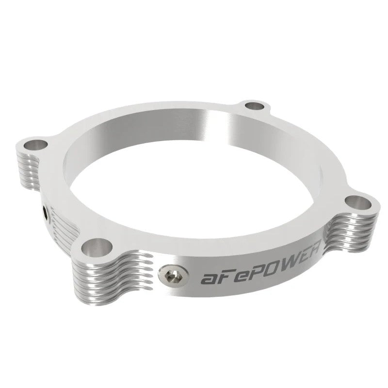 aFe Silver Bullet clear anodized 6061-T6 billet aluminum throttle body spacer with dual 1/8 inch NPT ports.