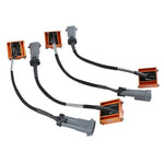 Set of four aFe Suspension Logic electronic shock delete modules with large GM-style Metri-Pack connectors.