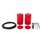 Two red poly Air Lift 1000 air springs with black air lines, T-fittings, and mounting hardware.