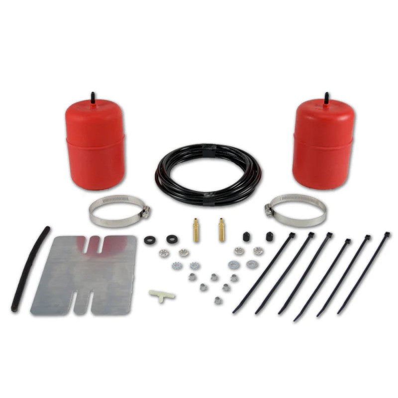 Red molded polyurethane Air Lift 1000 air springs with installation hardware and air lines for coil spring suspension.