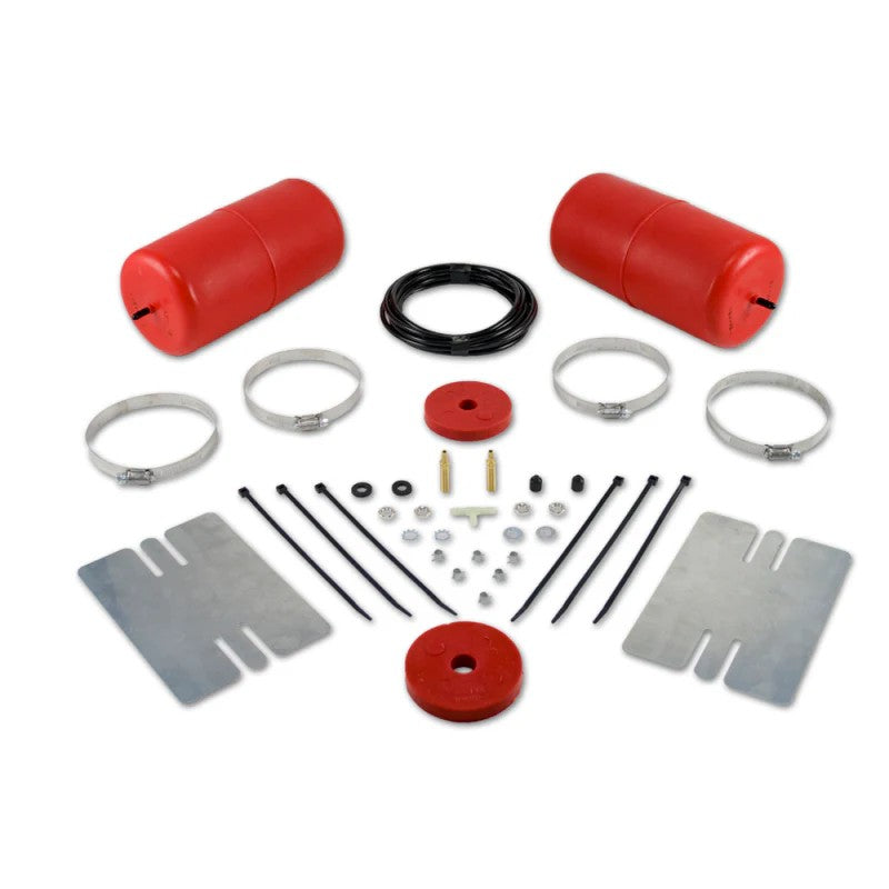 Red Air Lift 1000 polyurethane air springs with air line hose, clamps, and fittings for coil spring suspension.