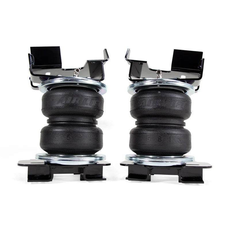 Air Lift LoadLifter 5000 air spring kit featuring two heavy-duty bellows, mounting brackets, and air line hardware.