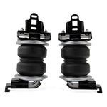 Air Lift LoadLifter 5000 air spring kit featuring reinforced bellows, steel roll plates, mounting brackets, and hardware.