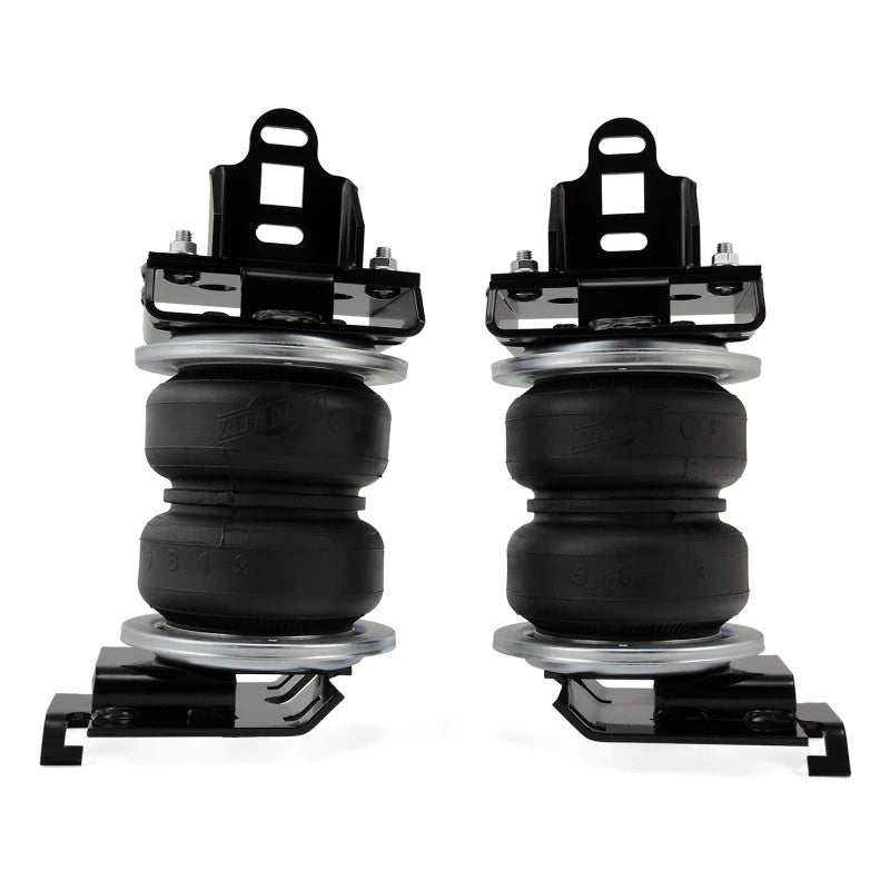 Air Lift LoadLifter 5000 air spring kit featuring reinforced bellows, steel roll plates, mounting brackets, and hardware.