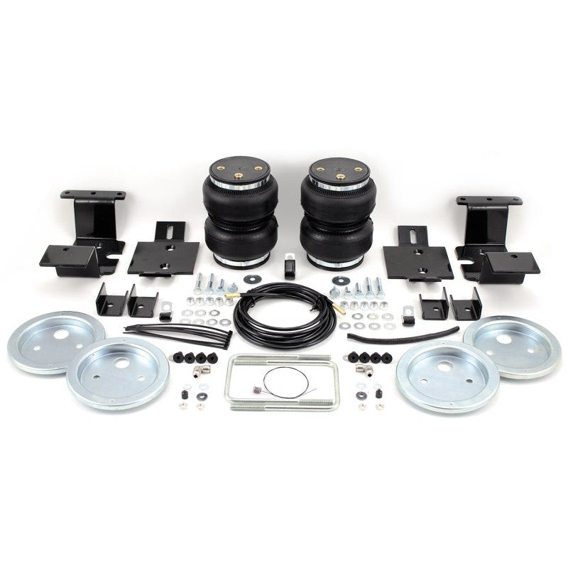 Air Lift LoadLifter 5000 air spring kit including bellows, roll plates, and heavy-duty mounting hardware.