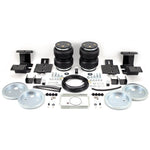 Air Lift LoadLifter 5000 air spring kit including bellows, roll plates, and heavy-duty mounting hardware.