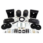 Air Lift 88212 LoadLifter 5000 Ultimate air springs with internal jounce bumpers, mounting brackets, and air line hardware.