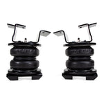 Air Lift LoadLifter 7500 XL Ultimate air spring kit showing 7-inch bellows, internal jounce bumpers, and mounting hardware.
