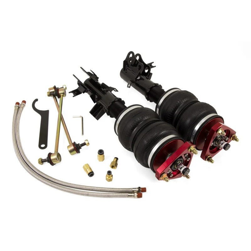 Air Lift Performance 78526 front air struts with red anodized camber plates and stainless steel braided lines.