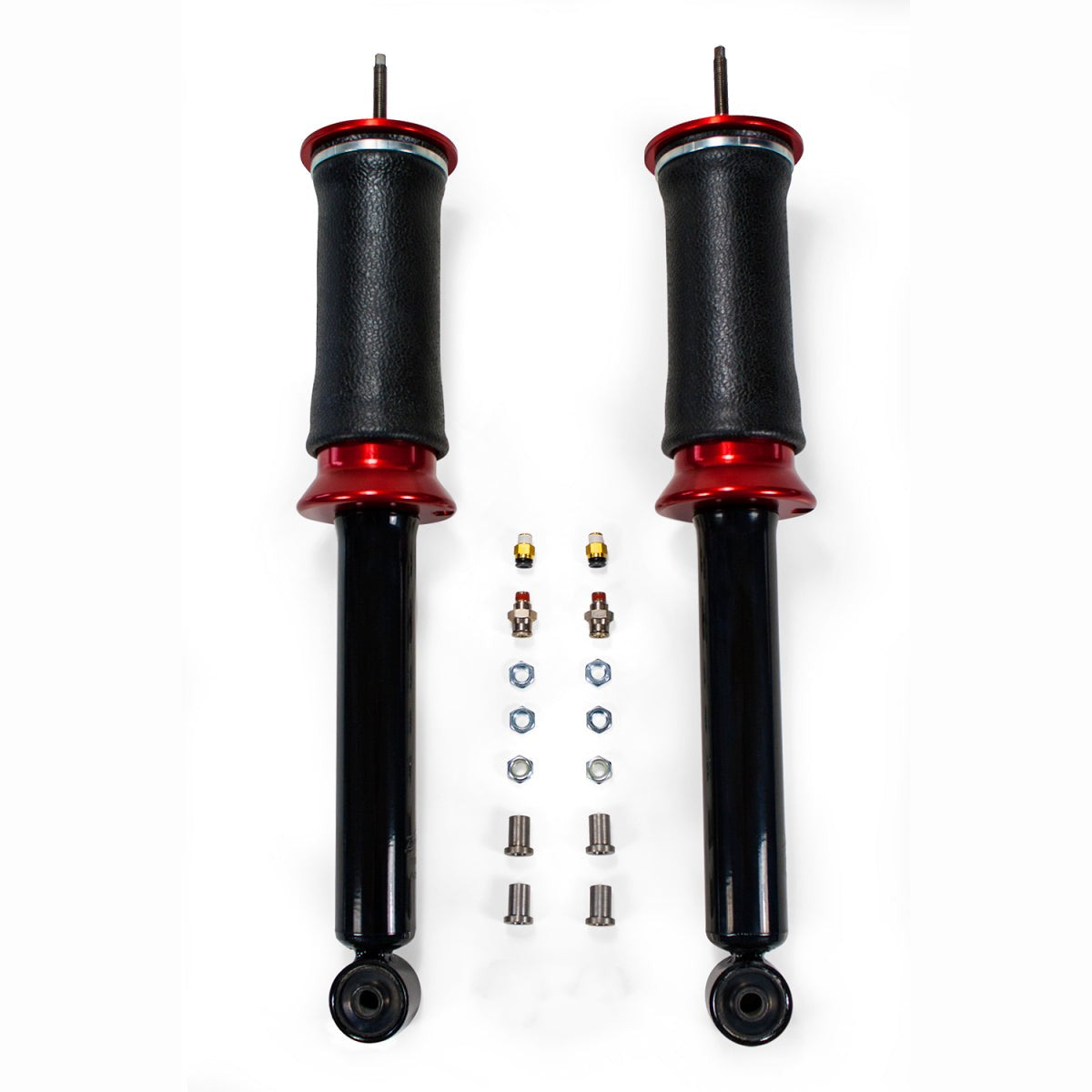 Rear air-over shocks with red anodized accents, braided stainless steel leader lines, and 1/4-inch PTC fittings.