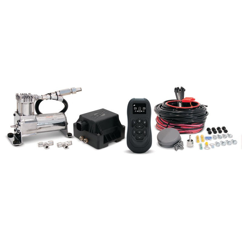 Air Lift 74000 WirelessAir V2 system featuring air compressor, dual-path manifold, wireless remote, and wiring harness.