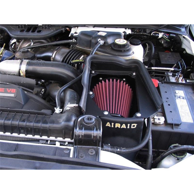 Airaid MXP series air intake housing and red oiled filter for 2003-2007 Ford Power Stroke 6.0L diesel trucks.