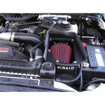 Airaid MXP series air intake housing and red oiled filter for 2003-2007 Ford Power Stroke 6.0L diesel trucks.