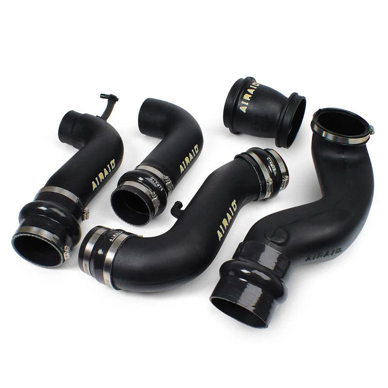 Airaid high-density polyethylene modular intake tube with stainless steel clamps and silicone couplers.