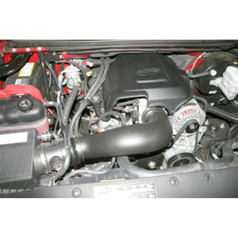 Airaid Jr. Intake Kit featuring a black modular intake tube and a red oiled high-flow replacement air filter.