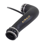 Airaid black high-density polyethylene modular intake tube with blue silicone couplers and stainless steel clamps.