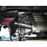 Airaid 511-213 CAD intake system featuring a red dry filter, black cold air dam panels, and intake tube for Toyota V8.