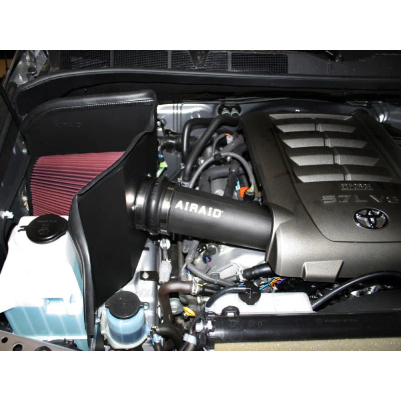 Airaid 511-213 CAD intake system featuring a red dry filter, black cold air dam panels, and intake tube for Toyota V8.