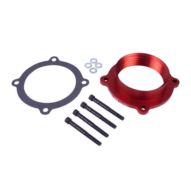 Airaid PowerAid throttle body spacer featuring the patented Helix Bore rifling and included mounting hardware.