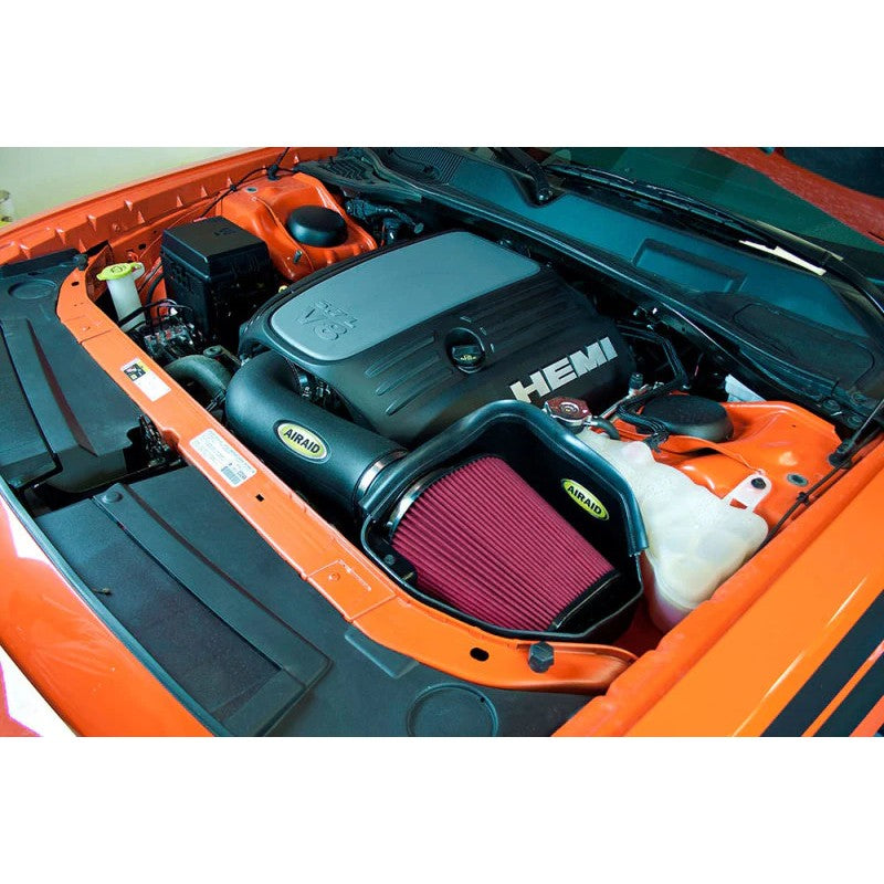 Airaid MXP cold air intake system featuring a black roto-molded air box and a red dry synthetic air filter.