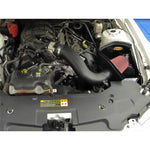 Airaid MXP cold air intake system for 3.7L Mustang featuring a black roto-molded air box and dry red synthetic air filter.