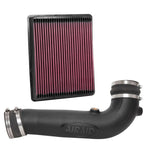 Airaid Jr. Intake Kit featuring a black modular intake tube and a red oiled performance air filter.