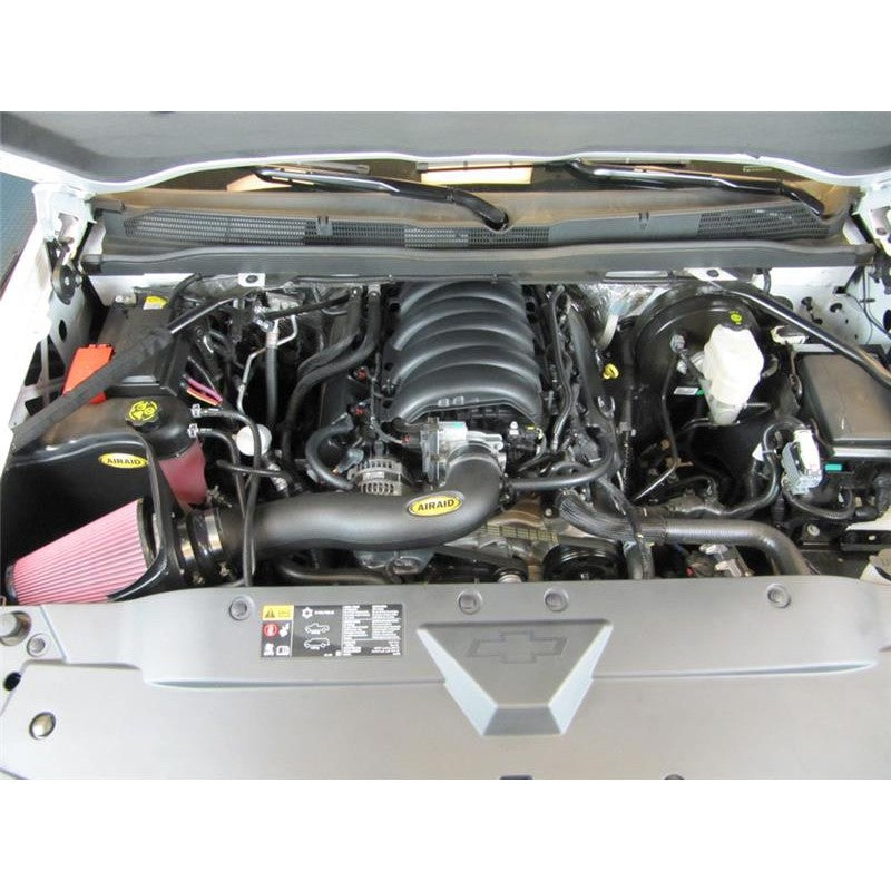 Airaid MXP cold air intake system with red dry filter, black roto-molded air box, and polyethylene intake tube
