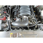 Airaid Jr. Intake Kit featuring a black modular intake tube and a red oiled high-flow air filter.
