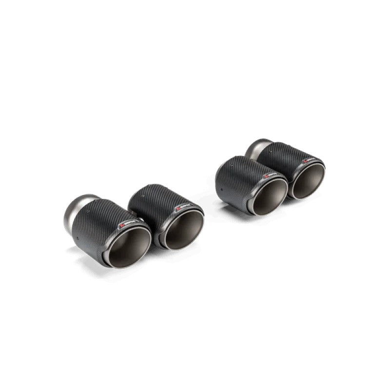 Akrapovic exhaust tail pipe set with cylindrical carbon fiber sleeves and titanium inner liners for BMW M2, M3, and M4.