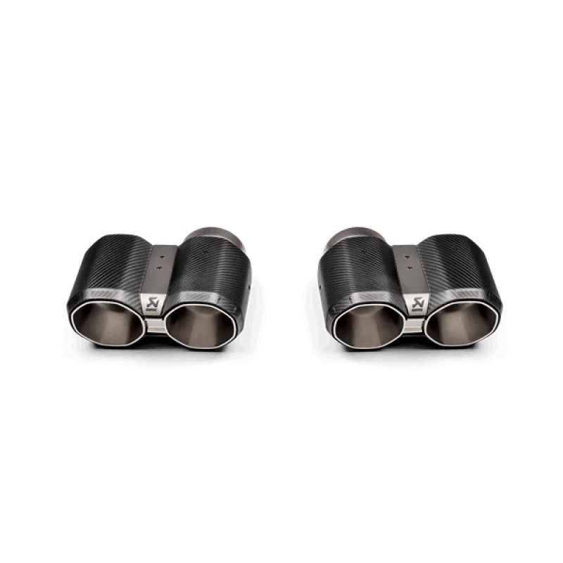 Akrapovic octagonal tail pipe set with carbon fiber sleeves and titanium core for BMW M2, M3, and M4 models.