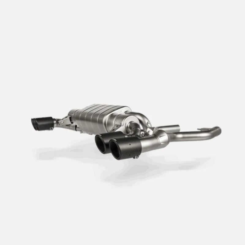 Akrapovic titanium slip-on exhaust for BMW M240i G42 featuring carbon fiber tailpipes and integrated exhaust valves.