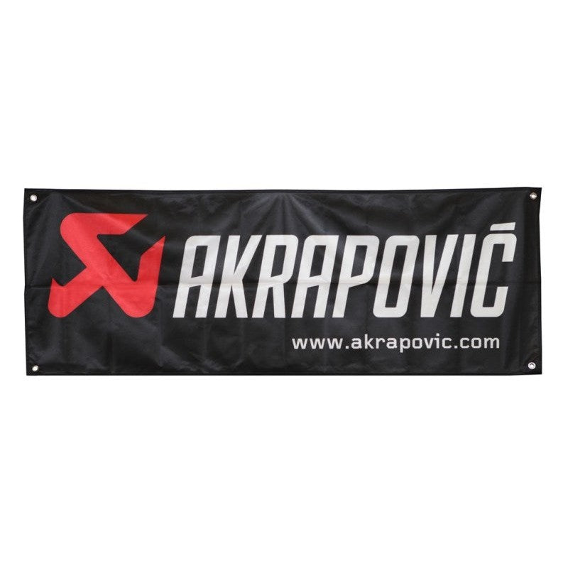 Official Akrapovic logo flag featuring the red and white brand mark on a black background, 140cm x 52cm.