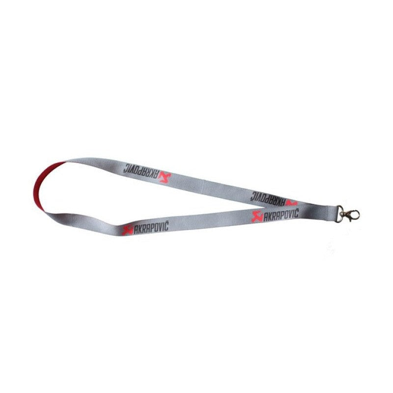 Akrapovic branded black lanyard featuring the company logo and a metal spring-gate attachment clip.