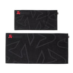 Black Akrapovic cotton towels with red embroidered logos and an 8 liter black waterproof dry bag.